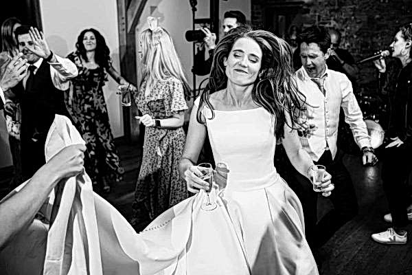 A bride gracefully dancing on the dance floor at a Dodford Manor wedding.