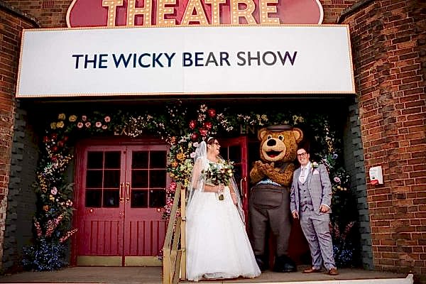 Dodford Manor Wedding Photographer captures the unforgettable moments of The Wicky Bear Show wedding in exquisite detail.