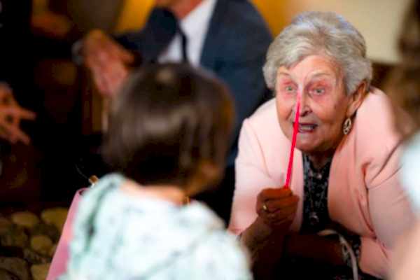 An older woman is talking to a little girl at Dodford Manor.