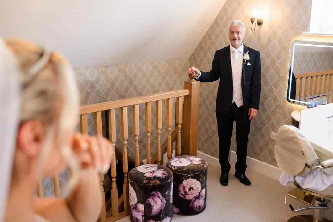 Bride sees father before wedding ceremony